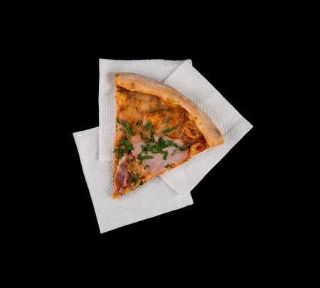 piece of pizza on an isolated black background