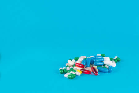 medication pills on blue background
