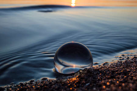 glass ball on the beach