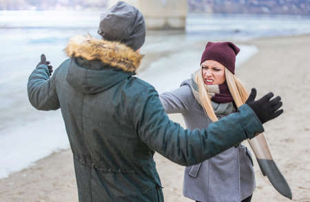 Young woman hitting her boyfriendの写真素材