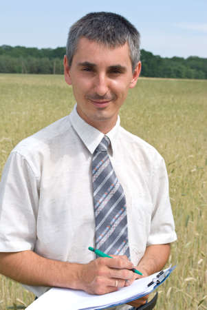 Man inspecting the wheatの写真素材