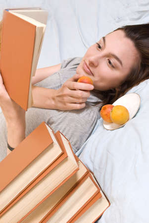 Portrait of young woman with  peach の写真素材