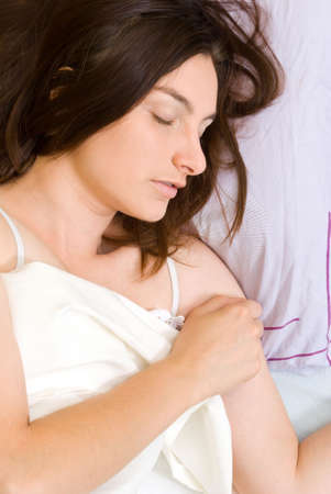 Beautiful young woman sleepingの写真素材