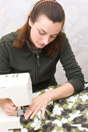 Hand sewing on a machineの写真素材