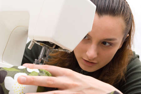 Hand sewing on a machineの写真素材