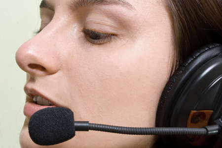 Close-up face of smiling woman in headphonesの写真素材