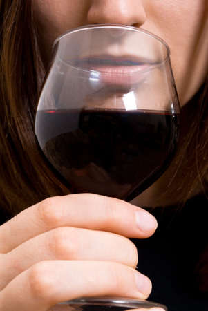Portrait of beautiful woman with glass red wine