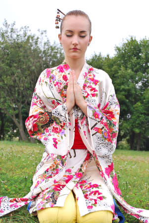 caucasian model dressed up in traditional japanese clothingの写真素材