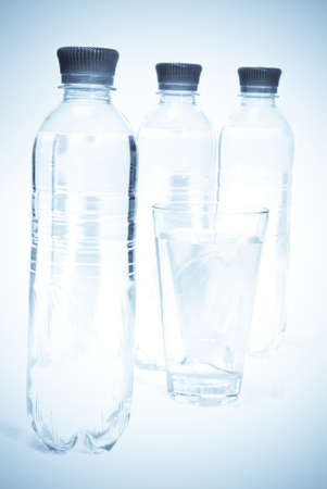 Plastic bottles of mineral water isolated on white backgroundの写真素材