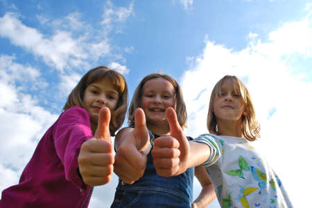 girls with thumb upの写真素材