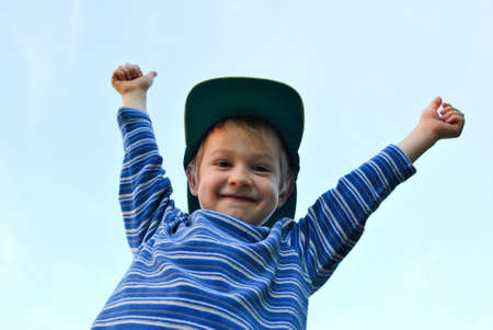 Adorable young boy looking at cameraの写真素材