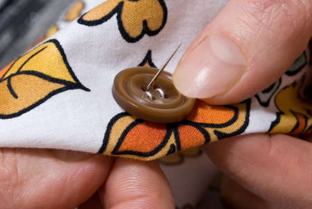   Needle and sewing buttonの写真素材
