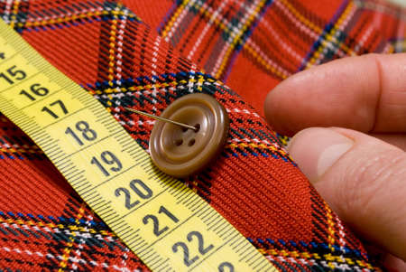 Needle and sewing buttonの写真素材