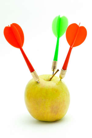 Darts and apple on a whiteの写真素材