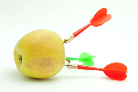 Dart and apple on a whiteの写真素材