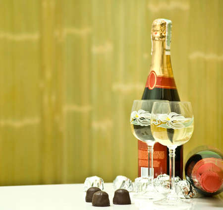 Glasses of champagne and a bottles of champagneの写真素材