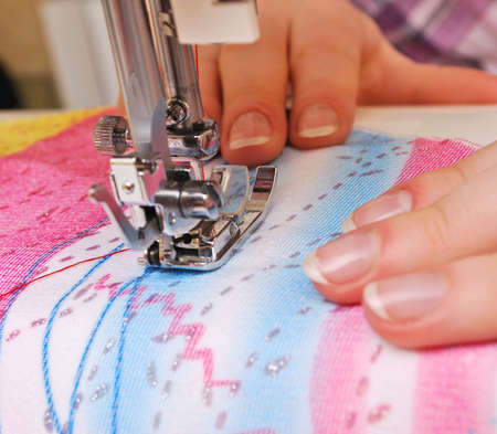 Hand sewing on a machineの写真素材