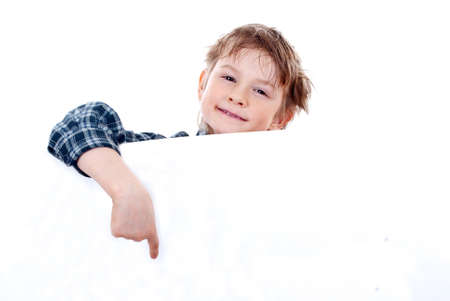 Boy holding a banner isolated on white backgroundの写真素材