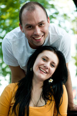 Closeup portrait of smiling young couple in love - Outdoorsの写真素材