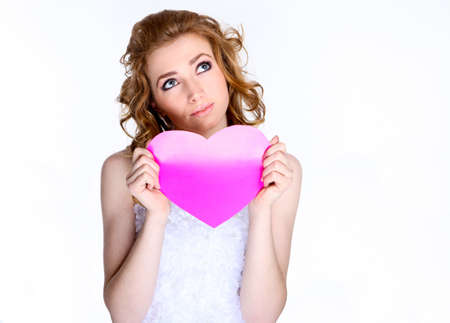 Portrait of happy bride in beautiful dress  with paper heartの写真素材