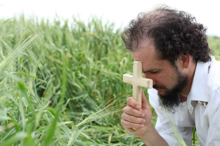 Man praying for good wheat year