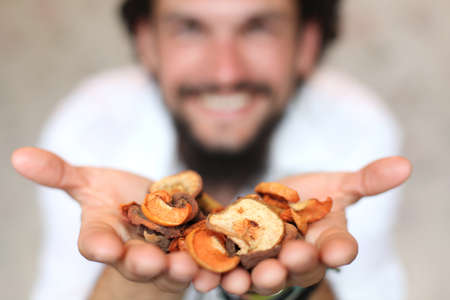 Hands with dried fruits の写真素材