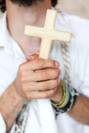 Man with the cross in handsの写真素材