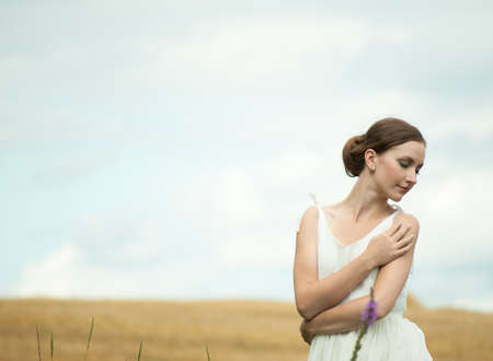 Young woman in the fieldの写真素材