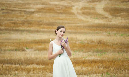 Young woman in the fieldの写真素材