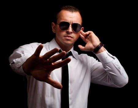 Portrait of secret agent standingの写真素材