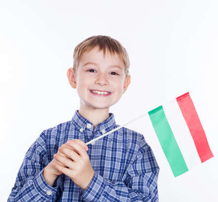 A little boy with Hungarian flag on the white backgroundの写真素材