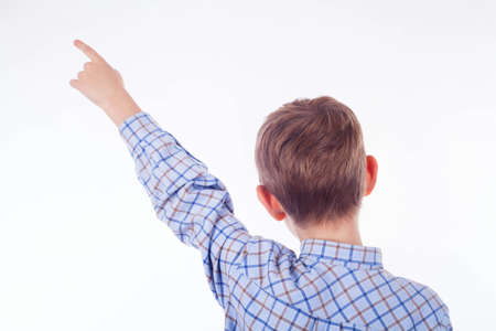 Happy boy pointing with his fingerの写真素材