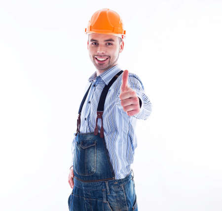 Portrait of a construction worker with hardhat making thumbs up signの写真素材