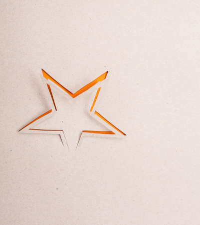 Origami star on the grey background.の写真素材