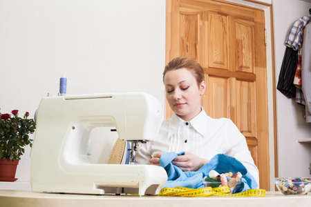 A sewer working on the sewing machine.