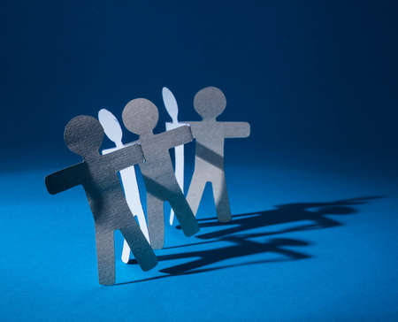 Partnership of paper team linked together.