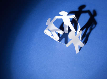 Partnership of paper team linked together.