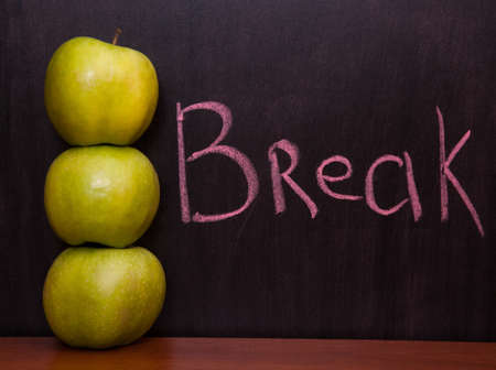 Classroom chalkboard with apples.