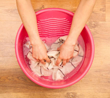 Hand delicate washing of clothes.の写真素材