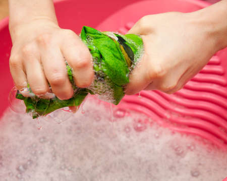 Hand delicate washing of clothes.の写真素材