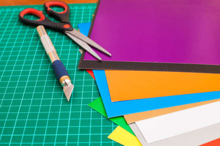 Cutting mat with paper and tools.Hobby at home.