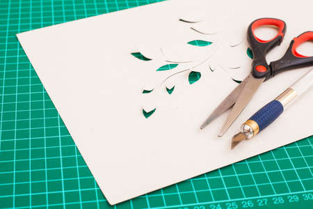 Cutting mat with paper and tools.Hobby at home.の写真素材