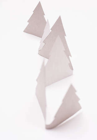 Christmas  white paper trees  on white background.の写真素材