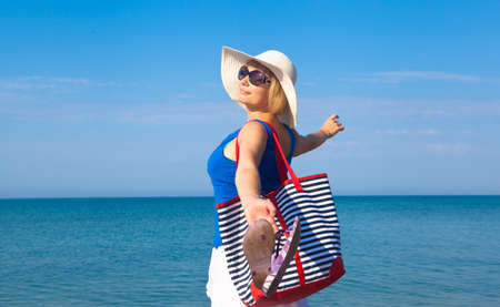 Beautiful girl relaxing outdoor at summer beachの写真素材