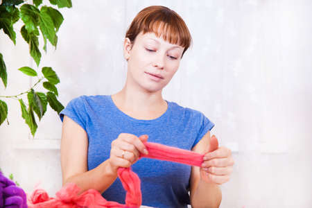 Woman making felting activity, in closeup shotの写真素材
