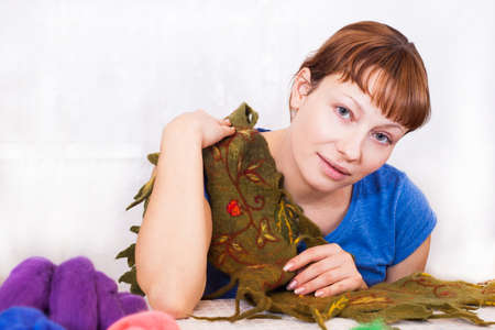 Felting activity, woman decorating a woolen scarfの写真素材