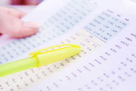 Image of female hand pointing at business document at the officeの写真素材