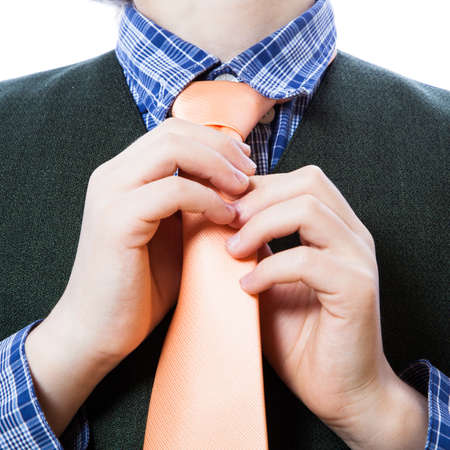Correcting a tie on the white background.Business concept.の写真素材