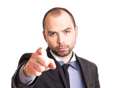 Handsome businessman pointing his finger at youの写真素材