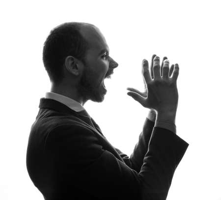 Caucasian businessman silhouette on the white backgroundの写真素材